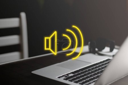 Foto de Yellow sound megaphone speaker icon on minimal workplace background. Sound design concept. - Imagen libre de derechos