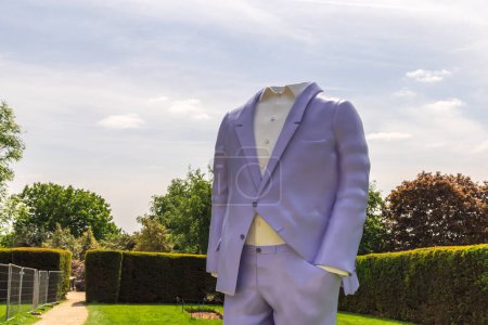 Photo for Wakefield, UK - May 29, 2023: Big Suit 2 (2010-2016) installation at Yorkshire Sculpture Park, part of Trap of the Truth exhibition by Austrian sculptor Erwin Wurm. - Royalty Free Image