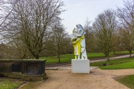 Wakefield, UK - May 29, 2023: Erwin Wurm bronze Balzac (2023) sculpture shown for the first time - the majestic human form created by elaborate layers of robes at the YSP.