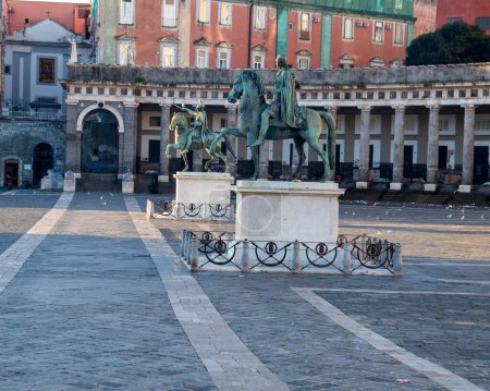 Early morning view of the iconic piazza plebiscito in naples, showcasing the impressive equestrian statues and historic architecture in the background