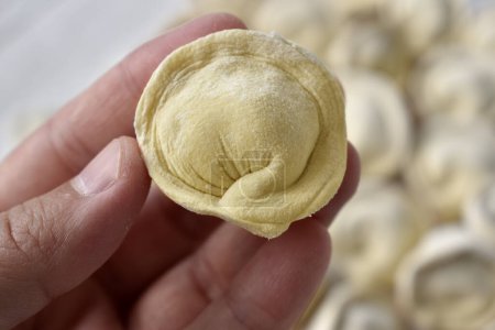 Photo for Close up raw dumpling in hand - Royalty Free Image
