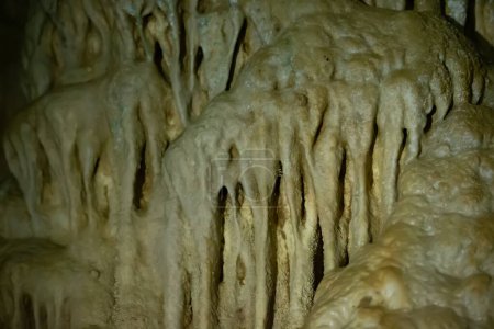 Photo for The cave is karst, amazing view of stalactites and stalagnites illuminated by bright light, a beautiful natural attraction in a tourist place. - Royalty Free Image