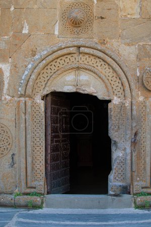 Entrance to an ancient stone church. Georgian temple.