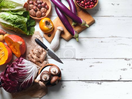 Foto de Top view groceries, healthy vegetarian ingredients for cooking a dinner on a white background - Imagen libre de derechos