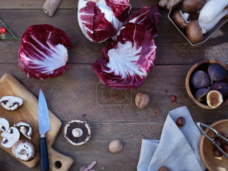 Foto de Seasonal produce viewed from above, healthy vegetarian ingredients for cooking a dinner on a wooden background - Imagen libre de derechos