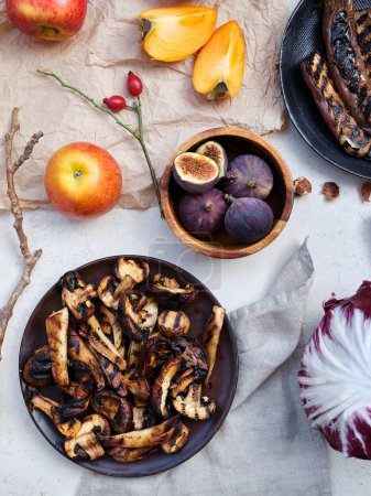 Photo for Flat lay seasonal vegetables, fruits and bread, healthy vegetarian ingredients. Grilled aubergines and mushrooms - Royalty Free Image