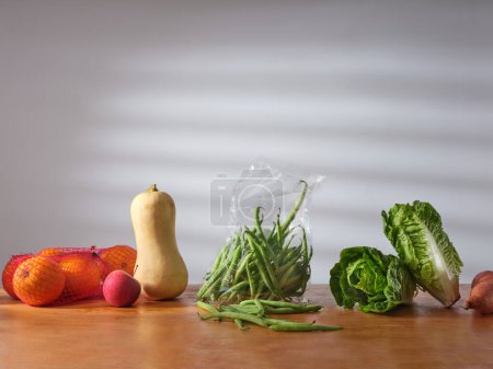 Foto de Fresh groceries on the kitchen counter. Food delivery concept. Vegetarian food ingredients - Imagen libre de derechos