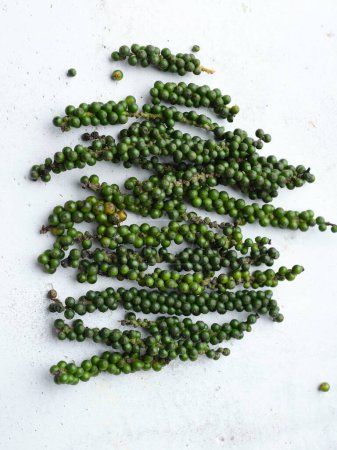 Photo for Green peppercorns on light background - Royalty Free Image