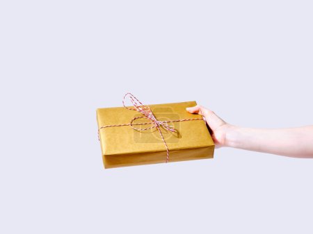 Photo for Holiday gift box in hands of a female model - Royalty Free Image
