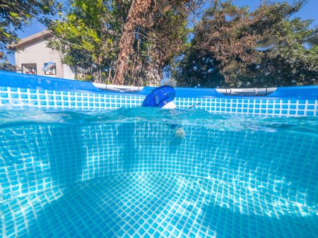 Photo for Split underwater view of a chlorine floater dispenser in a pool of a private house - Royalty Free Image