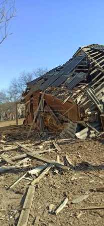 Photo for Chernihiv - Ukraine. 25 March 2022: Destruction of private building after being hit by artillery shell in Chernihiv where shell hit. dilapidated house during Russian-Ukrainian War - Royalty Free Image