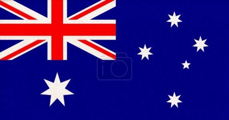 Flagge Australiens auf einer Stoffoberfläche. Australische Nationalflagge auf strukturiertem Hintergrund. Australische Staatsflagge. Textur. Commonwealth von Australien