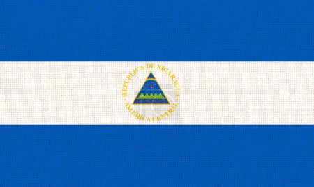 Flag of Nicaragua. Nicaragua flag on fabric surface. Fabric Texture. National symbol. Republic of Nicaragua. Caribbean country