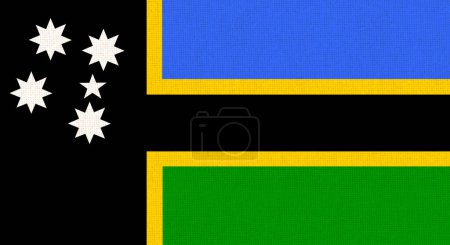 Die Flagge der australischen Südseeinseln weht auf einer Stoffoberfläche. Illustration der Flagge der australischen Inseln. Australisches Nationalsymbol.