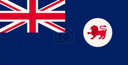 Flagge Tasmaniens auf Stoffoberfläche. Illustration der australischen Flagge von Tasmanien. Australisches Nationalsymbol. Blaue Flagge Tasmaniens. Symbol der australischen Insel. Tasmanisches Symbol