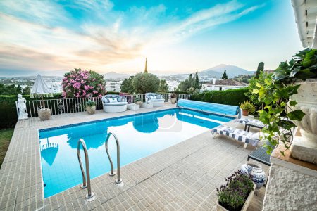 Téléchargez les photos : A poolside image from a luxury chalet overlooking the Costa Del Sol - en image libre de droit