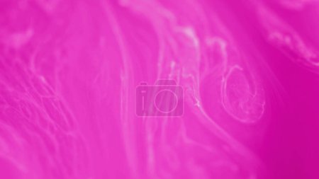 Neon mist. Pink ink flow. Defocused vibrant magenta white color wet paint shimmering texture stream motion in water art abstract background.