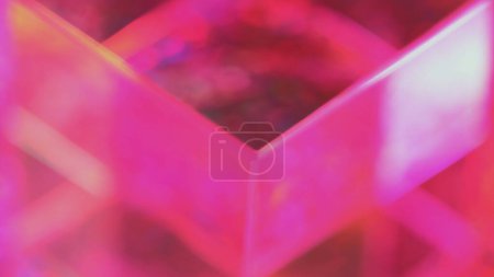 Bokeh crystal. Colorful illumination. Defocused pink neon lights passing through glass prism purple circles abstract spinning background blur.