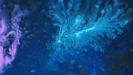 Acrylic paint splash. Sparkling fluid. Defocused blue pink cyan color shimmering glitter particles ink pigment emulsion liquid flow abstract art background.