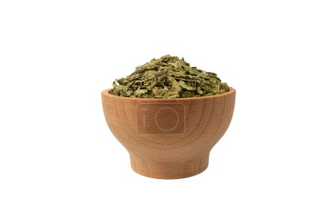 Photo for Dried leaves o Lemon verbena in latin Aloysia citrodora in wooden bowl isolated on white background. Medicinal herb. Lemon verbena leaf extract is used for its energizing and refreshing properties, lemony scent. - Royalty Free Image