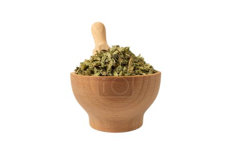 Photo for Dried leaves o Lemon verbena in latin Aloysia citrodora in wooden bowl and scoop isolated on white background. Medicinal herb. Lemon verbena leaf extract is used for its energizing and refreshing properties, lemony scent. - Royalty Free Image