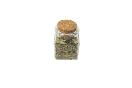 Photo for Dried leaves o Lemon verbena in latin Aloysia citrodora in a glass jar isolated on white background. Medicinal herb. Lemon verbena leaf extract is used for its energizing and refreshing properties, lemony scent. - Royalty Free Image
