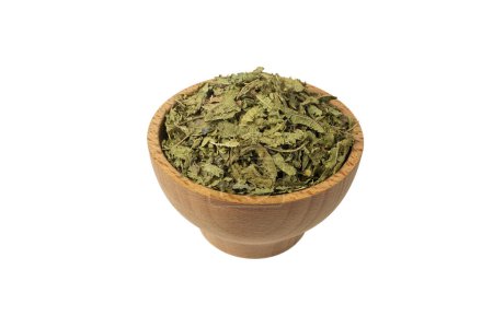 Photo for Dried leaves o Lemon verbena in latin Aloysia citrodora in wooden bowl isolated on white background. Medicinal herb. Lemon verbena leaf extract is used for its energizing and refreshing properties, lemony scent. - Royalty Free Image