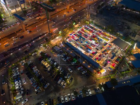 Photo for Aerial top view of Night Market people walking street, Colorful tents in the train of Ratchada at Bangkok city, Thailand. Rerail shops - Royalty Free Image