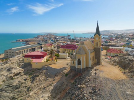 Aerial top view of Evangelical Lutheran Church in urban city town of Namibia, South Africa. Tourist attraction