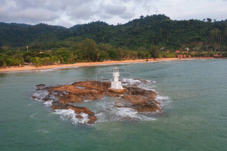 Photo for Aerial top view of lighthouse tower, Khao Lak with seawater, Andaman sea in Phang Nga Bay island in summer season, Thailand. Tourist attraction. - Royalty Free Image