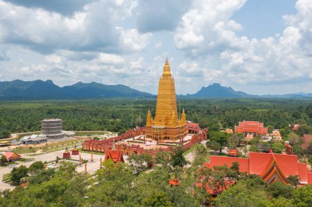 Photo for Wat Bang Thong, Krabi, Southern Temple. The pagoda is a buddhist temple in urban city town, Thailand. Thai architecture landscape background. Tourist attraction landmark. - Royalty Free Image