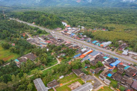 Photo for Aerial view of local residential neighborhood roofs. Urban housing development from above. Top view. Real estate in Sukhothai urban city town, Thailand. Property real estate. - Royalty Free Image