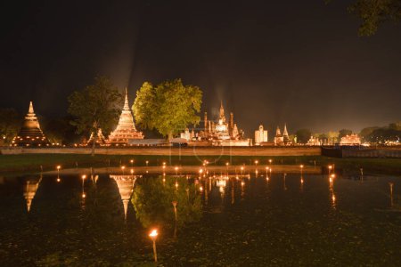 Photo for Sukhothai Historical Park festival, buddha pagoda stupa in a temple, Sukhothai, Thailand. Thai buddhist temple architecture at night. Tourist attraction. - Royalty Free Image