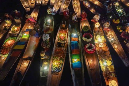 Photo for Damnoen Saduak Floating Market or Amphawa. Local people sell fruits, traditional food on boats in canal, Ratchaburi District, Thailand. Famous Asian tourist attraction destination. Festival in Asia. - Royalty Free Image