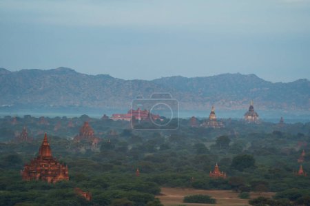 Photo for Aerial top view of burmese temples of Bagan City from a balloon, unesco world heritage with forest trees, Myanmar or Burma. Tourist destination. - Royalty Free Image