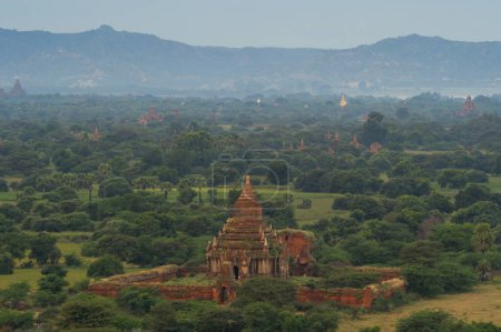 Photo for Aerial top view of burmese temples of Bagan City from a balloon, unesco world heritage with forest trees, Myanmar or Burma. Tourist destination. - Royalty Free Image