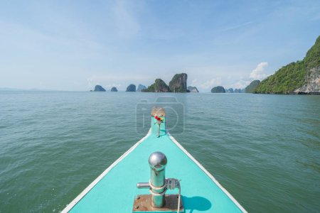 Photo for Sailing local wooden boat in the sea ocean and tree forest. Nature environment landscape background. - Royalty Free Image