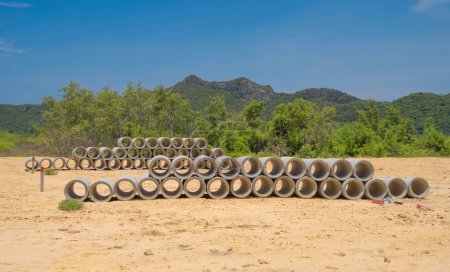 Drainage Concrete Pipe with mountain hills.