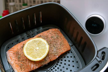 Photo for Salmon with lemon made in an air fryer - Royalty Free Image