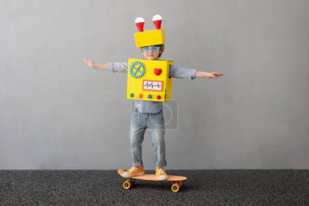 Photo for Happy child with robot. Funny kid have an idea. Success, creative and innovation technology concept - Royalty Free Image
