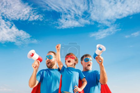 Photo for Senior, man and child outdoor against summer blue sky. Grandfather, father and son pretend to be superheroes. People having fun together. Family vacation and holiday concept. Happy Father's day - Royalty Free Image