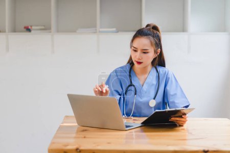 Healthcare Professional Analyzing Patient Data on Digital laptop