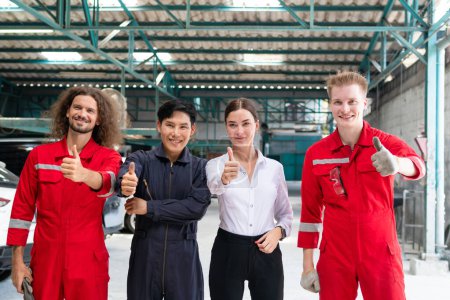 Photo for Portrait of a young confident managers and car mechanic team showing thumbs up in repair garage, Car repair and maintenance concepts - Royalty Free Image