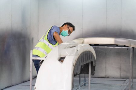 Photo for Senior mechanic man painting car in chamber, Technician checking the quality of the painting, Garage painting car service repair and maintenance - Royalty Free Image