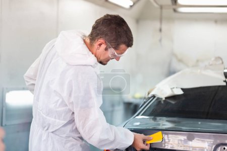 Photo for Repairman checking shades cards for car painting, Worker painter checking color matching before painting, Garage painting car service repair and maintenance - Royalty Free Image