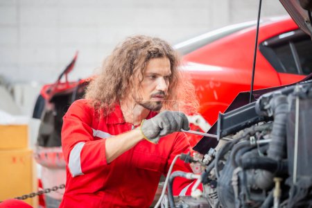 Photo for Technician man working in auto repair shop, Car mechanic in repair garage, Car repair and maintenance concepts - Royalty Free Image