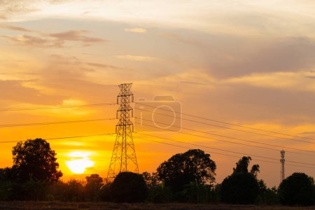 Photo for Silhouette High voltage electric tower at sunset time, sky at sunset time background - Royalty Free Image