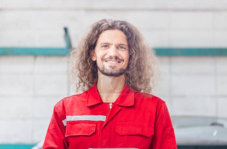Photo for Cheerful the mechanic man in repair garage, Technician man working in auto repair shop, Car repair and maintenance concepts - Royalty Free Image