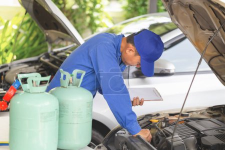 Photo for Car Air Conditioning Repair, Technician checked car air conditioning system refrigerant recharge, Repairman check and fixed car air conditioner system - Royalty Free Image