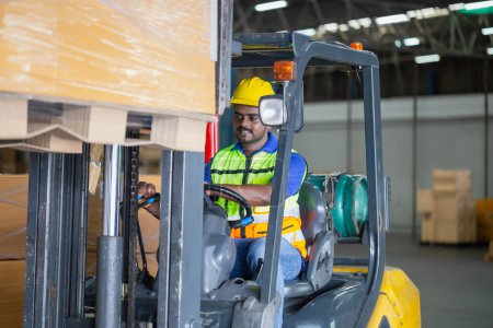 Photo for Worker driver at warehouse forklift loader works to containers box, worker man in warehouse with forklift - Royalty Free Image